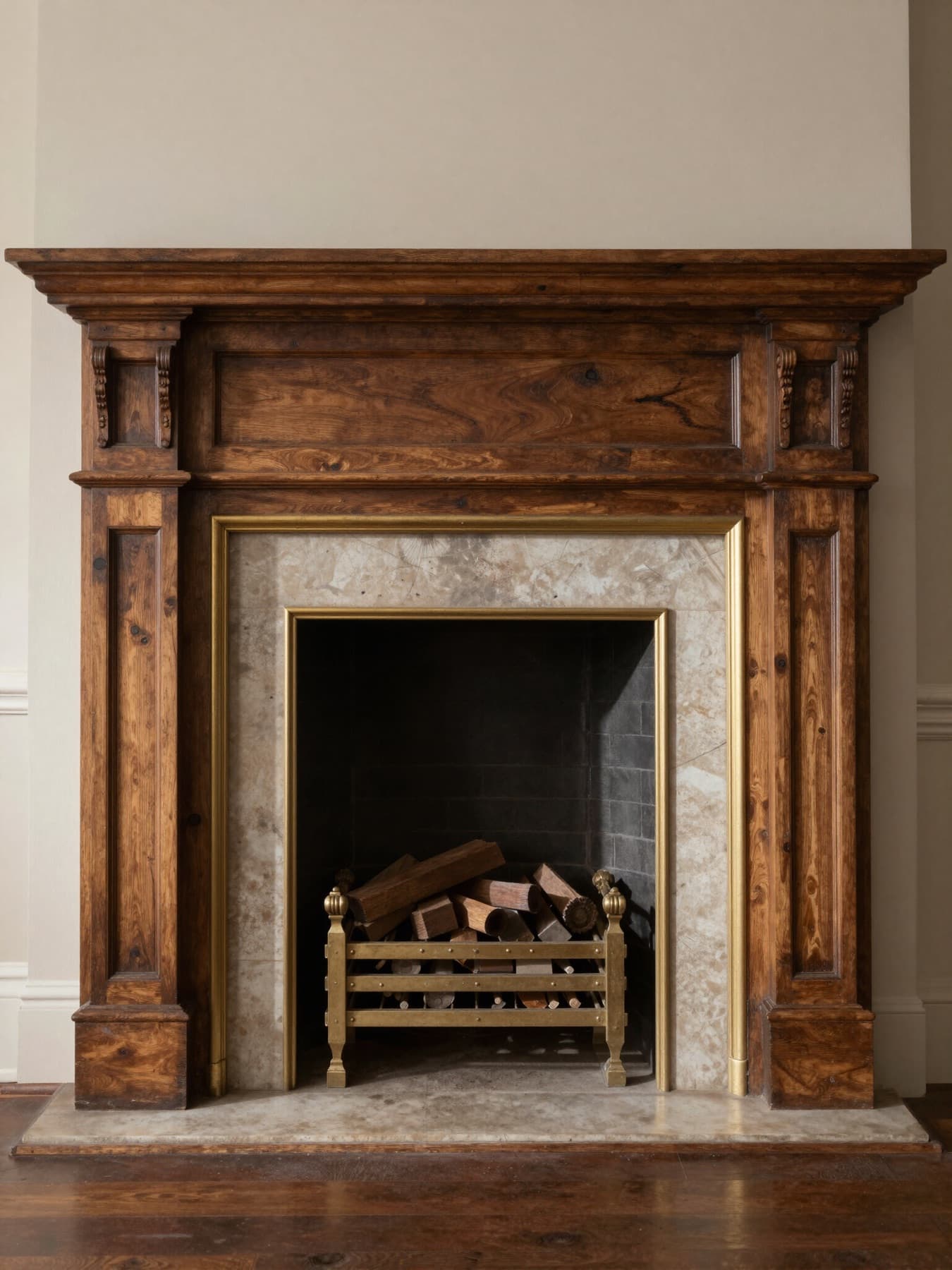 Restored wood fireplace mantel with brass details